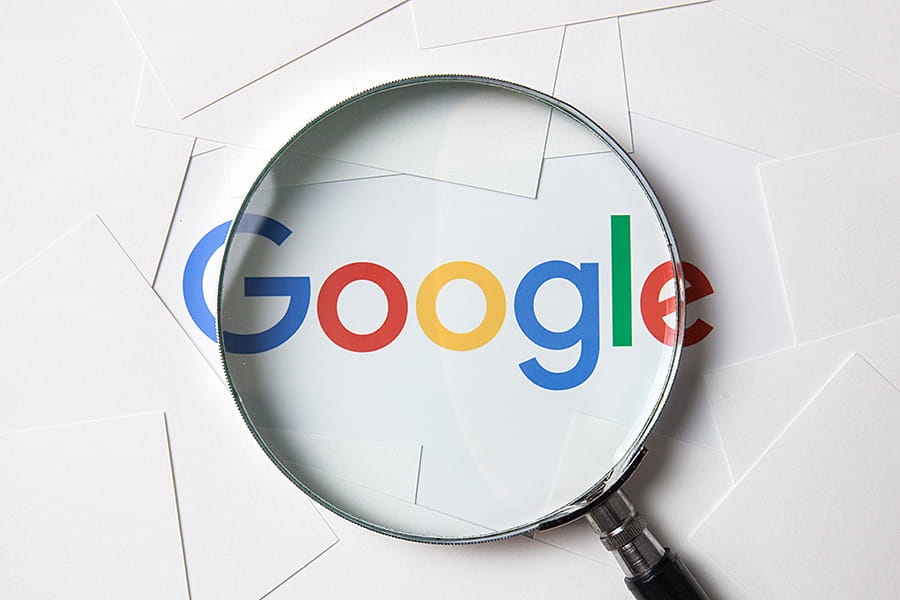 Google Logo under a Magnifying Glass